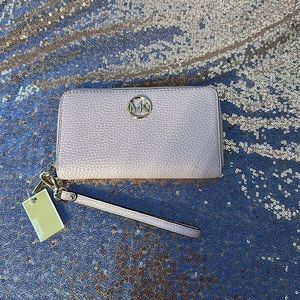 Micheal Kors womens zip wallet with strap. Pink with gold & tag.